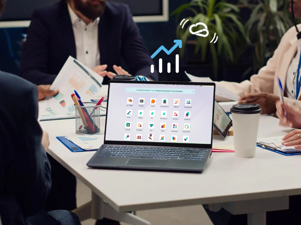A group of people sitting around a computer displaying a list of Binhex Cloud applications on the screen