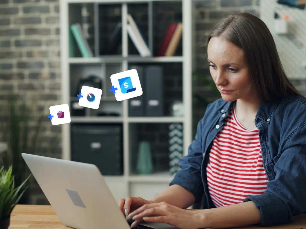 A woman intently using her computer