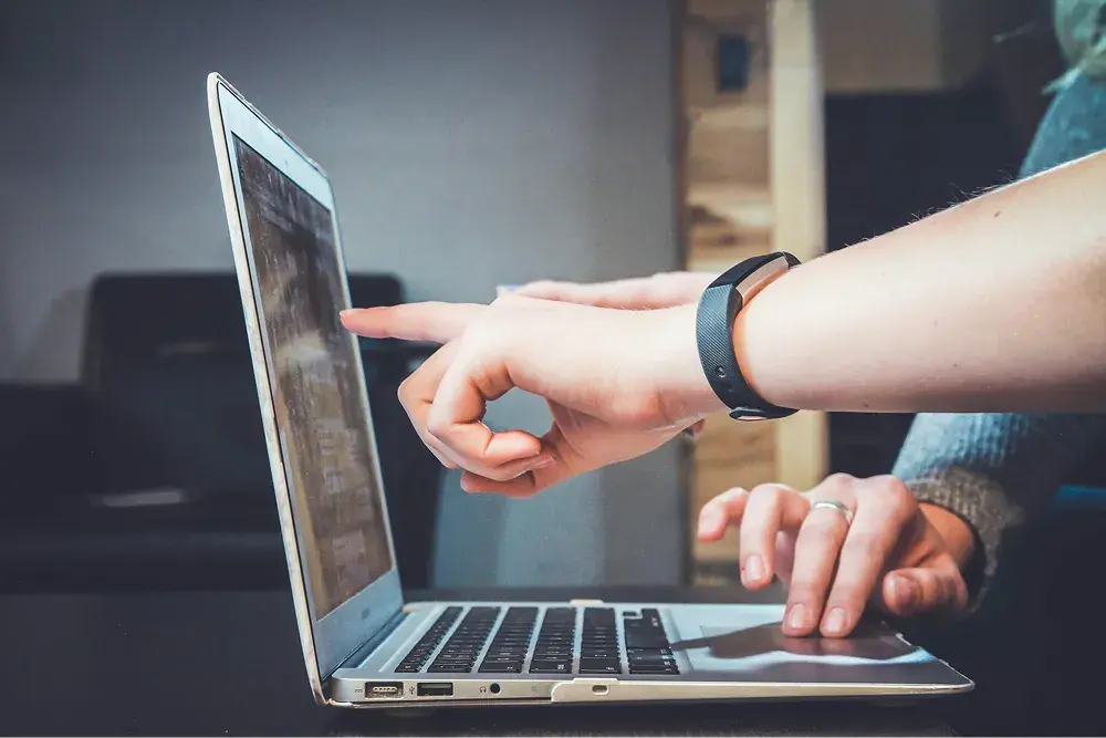 people looking at what appears on a computer screen